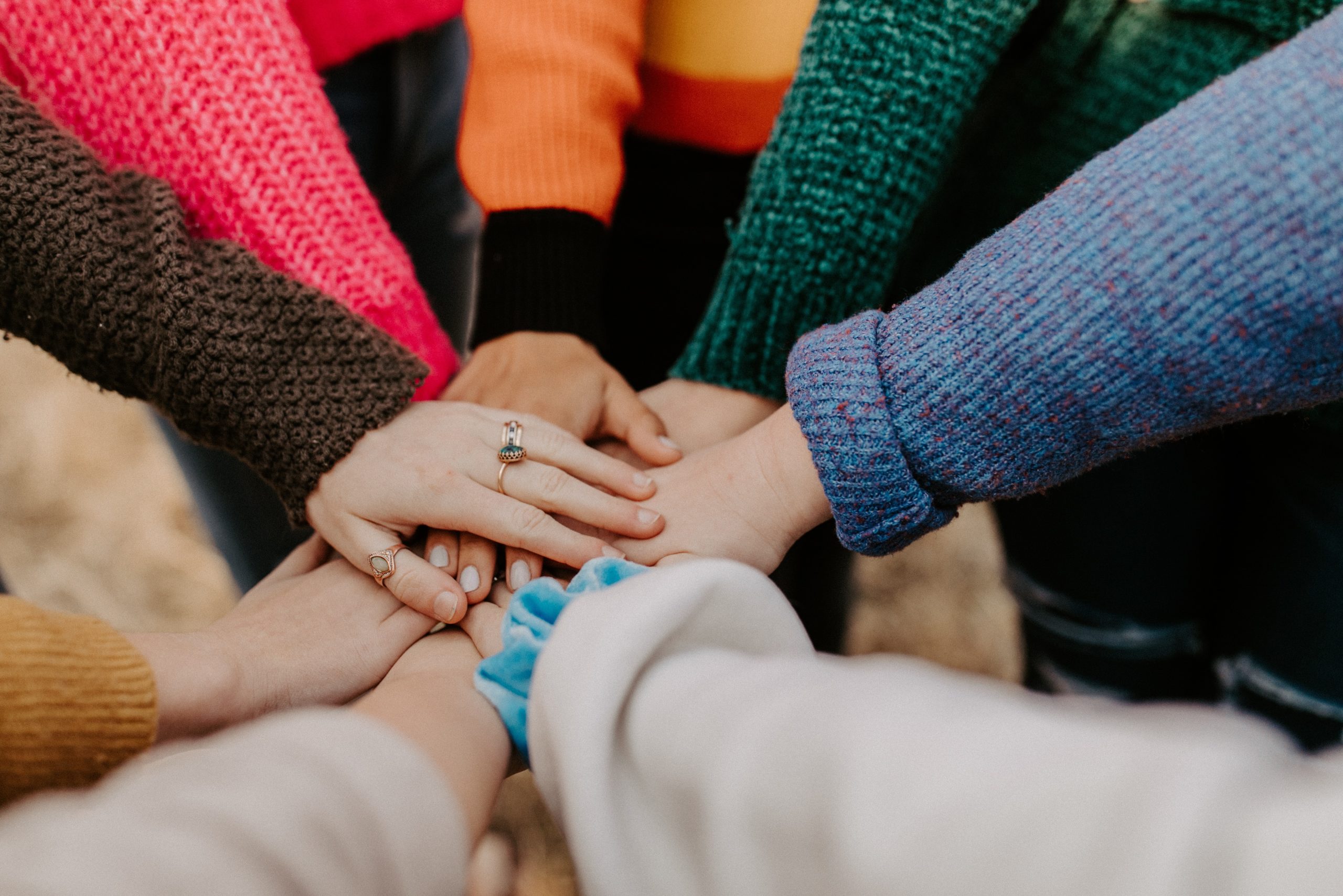 hannah-busing-Zyx1bK9mqmA-unsplash Hands joined together